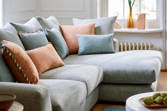 The Weymouth Corner Sofa Bed in Textured Weaves Argent With Dark Oak Feet