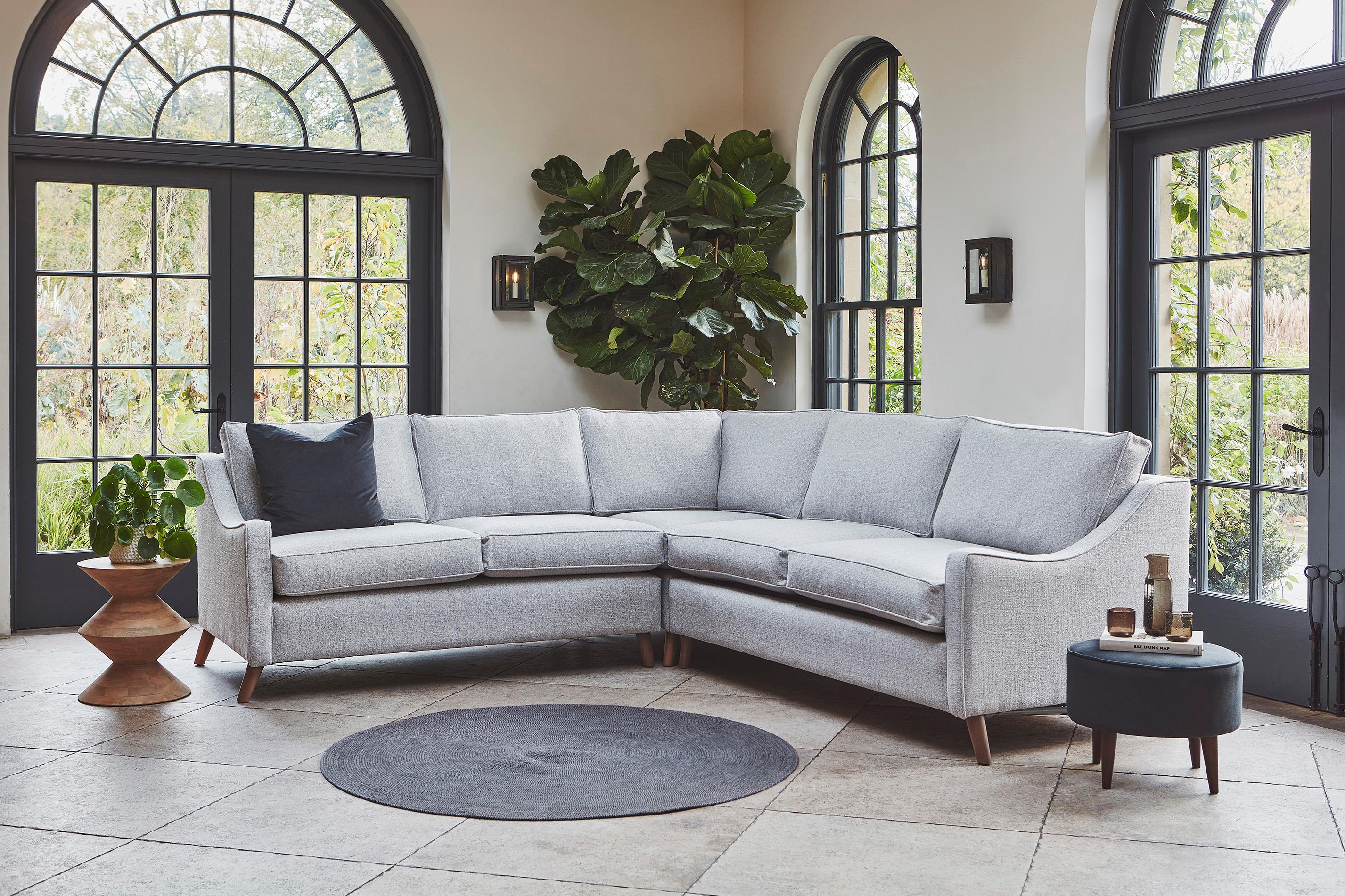 The Weymouth Corner Sofa Bed in Textured Weaves Argent With Dark Oak Feet